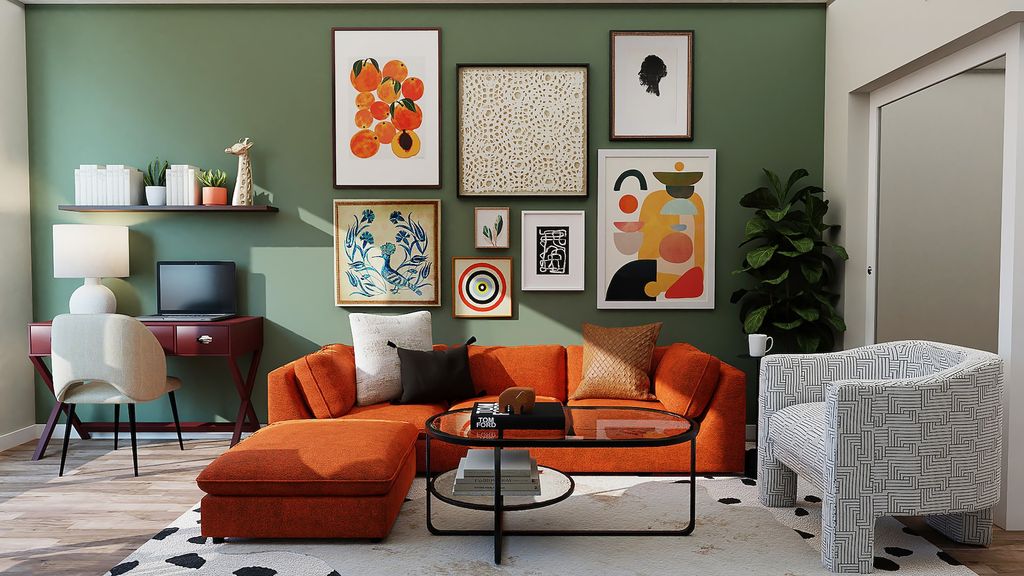 Living room with red couch, grey chair and colourful art pieces on green statement wall