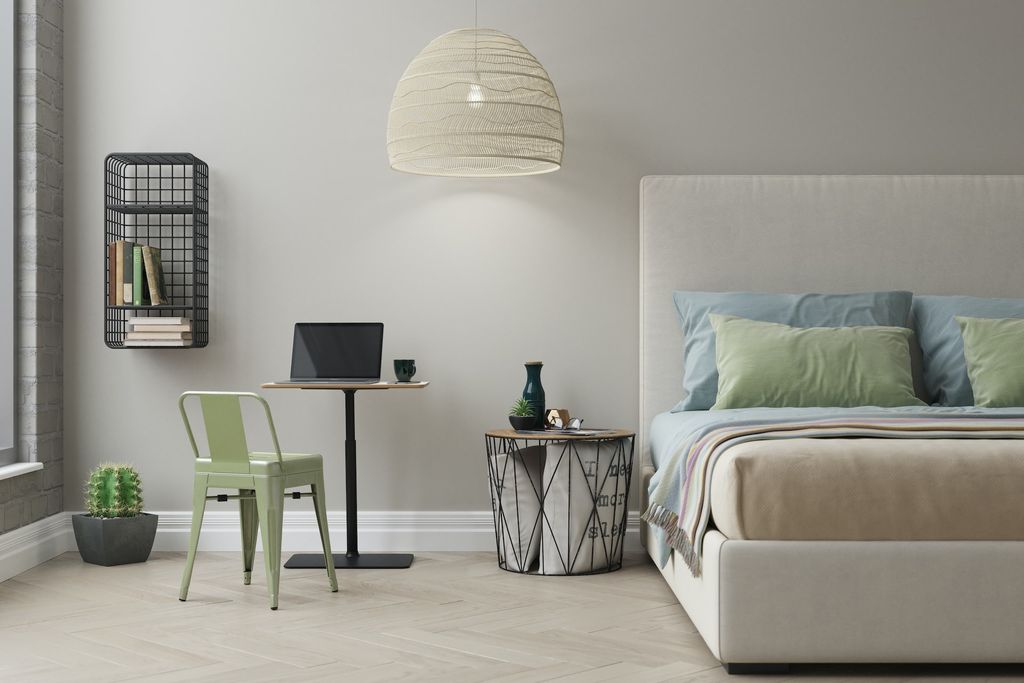 Bedroom with minimal, modern furniture and big hanging light