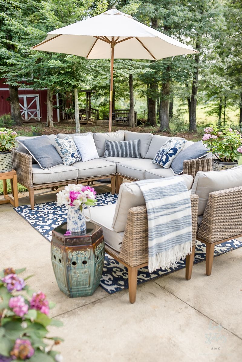 Patio furniture with blue accent colors and patio umbrella