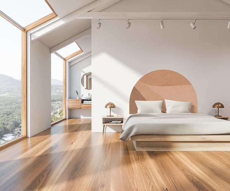 Bedroom with light brown floors and scandinavian furniture