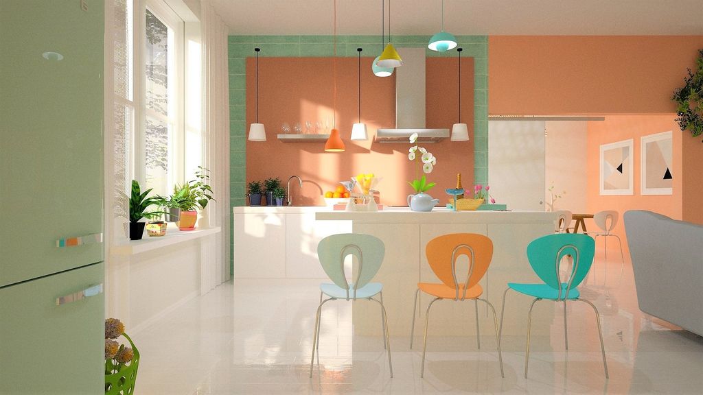 Pastel color kitchen with mismatched colorful chairs and mint refrigerator 
