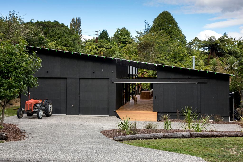 Large black shed with double garage