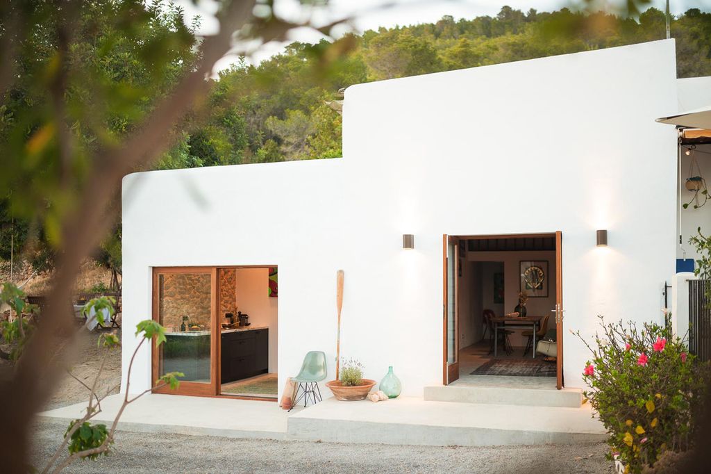 White stucco house with double doors