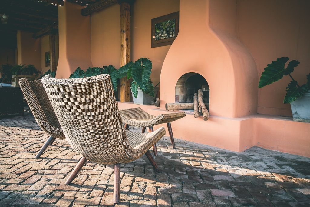 Patio with wicker chairs and firepit