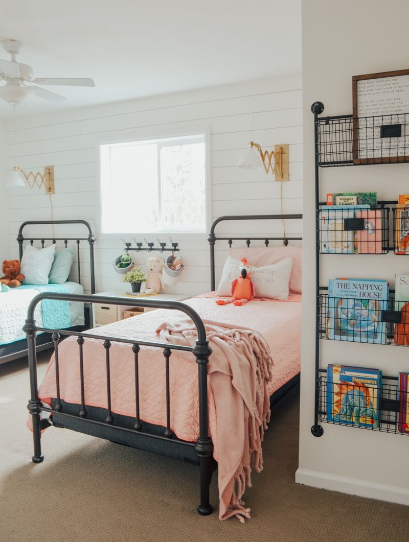 Blue and pink bedding on steel kids beds