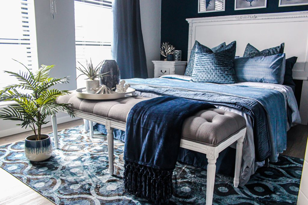 Grey and blue bedroom with velvet throw blanket
