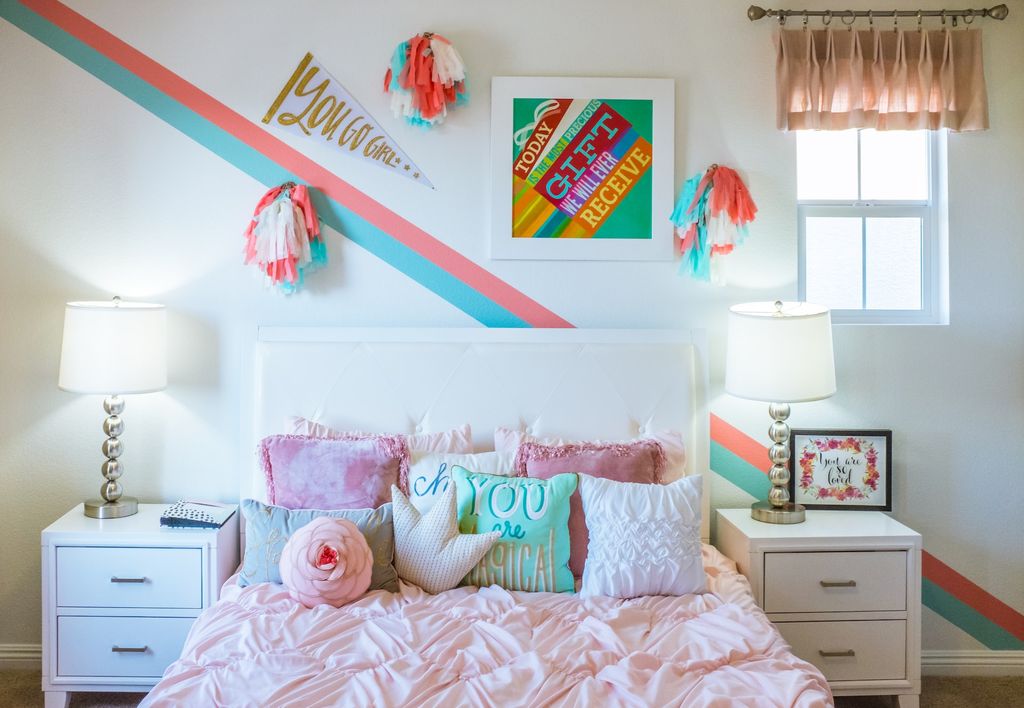 Girl bedroom with bold pink colors and patterns on the wall