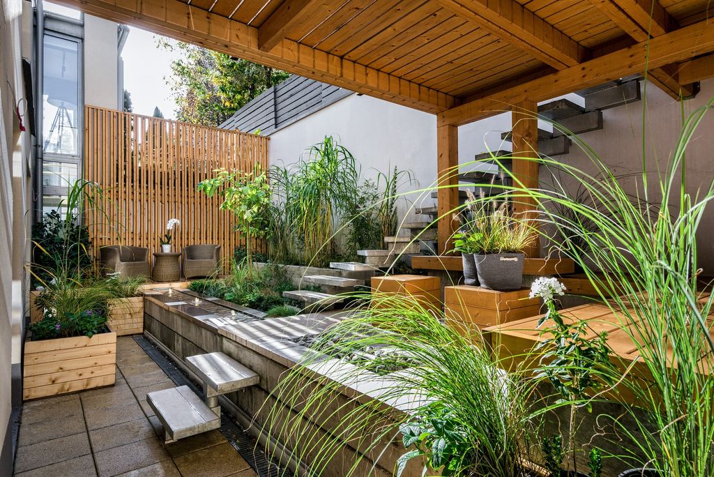 Terrace with greenery and wooden furniture and panels 