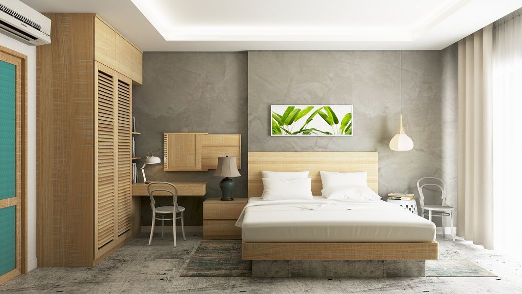 Bedroom with grey walls and wooden furnishings 