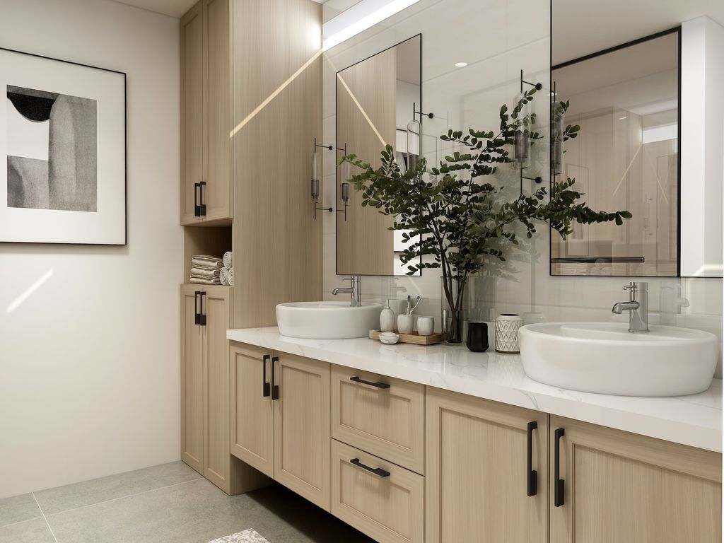Bathroom with light beige cabinets and two sinks