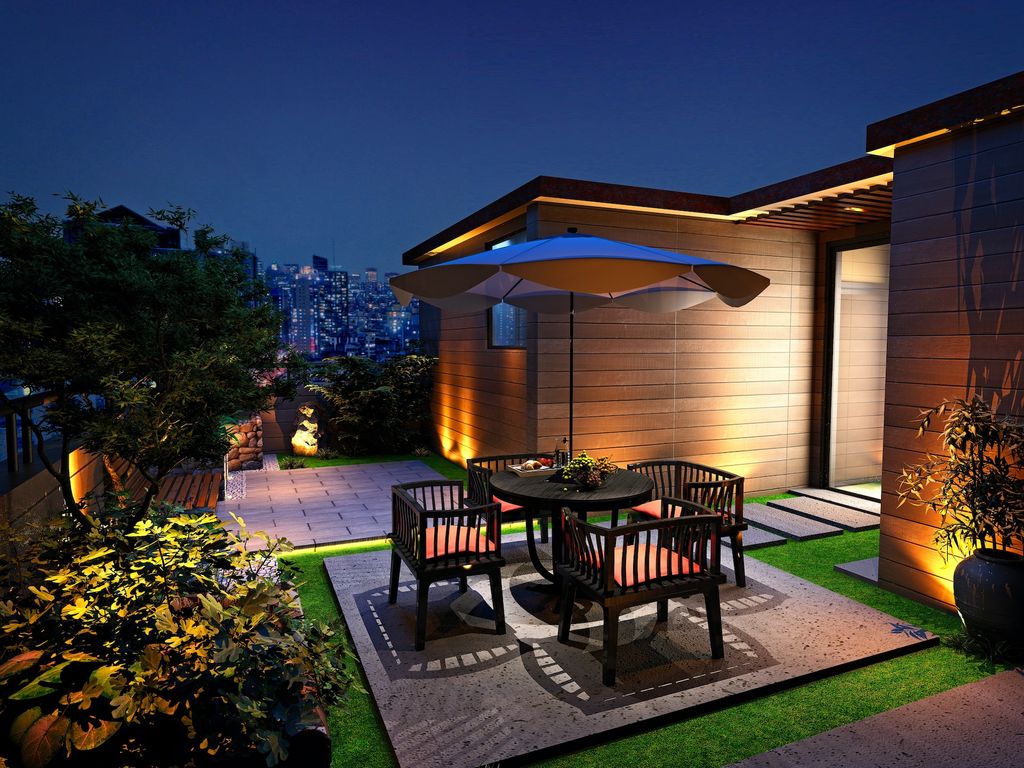 Outdoor terrace with table, chairs and subtle lighting