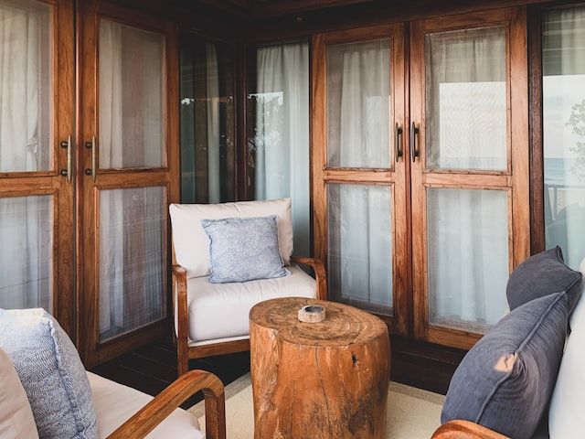 Patio with wooden chairs and tree trunk table