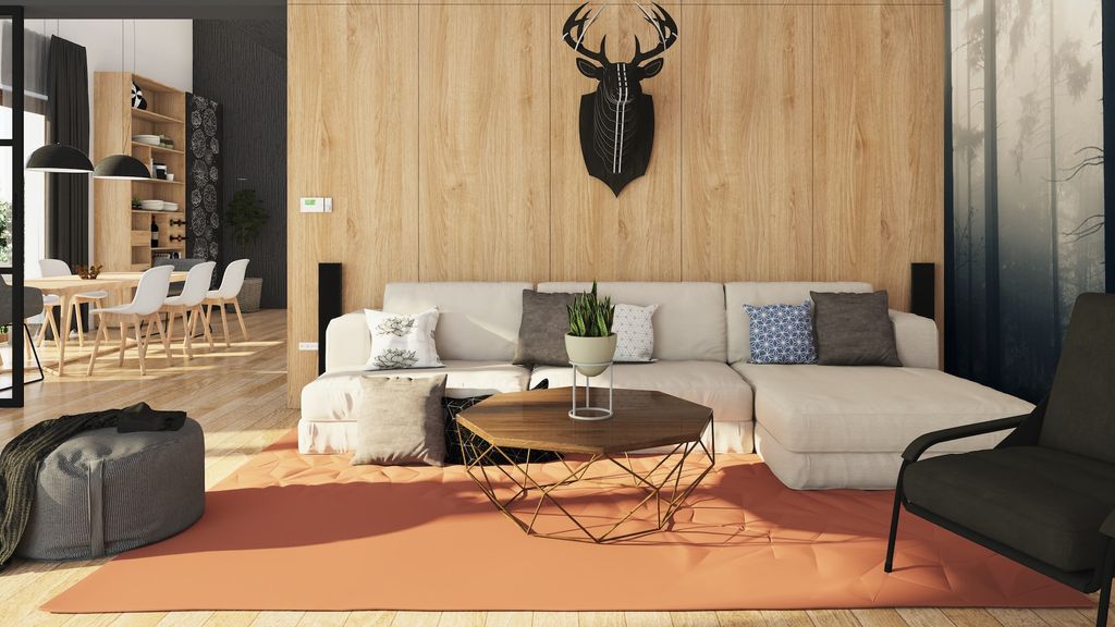 Beige sofa with wood backdrop and reindeer mounted on the wall