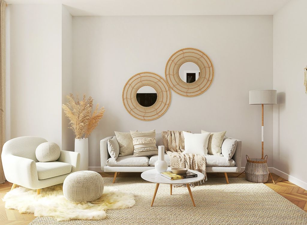 Beige and white living room furniture with wicker accents and fur rug