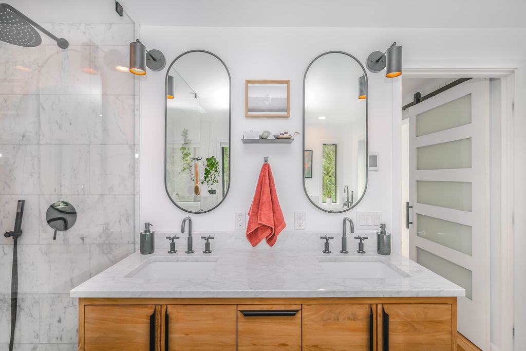 Bathroom with granite double sink and wooden vanity