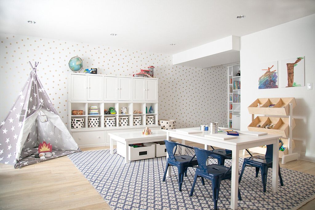 Kids bedroom with teepee, work and play area in navy and white colors