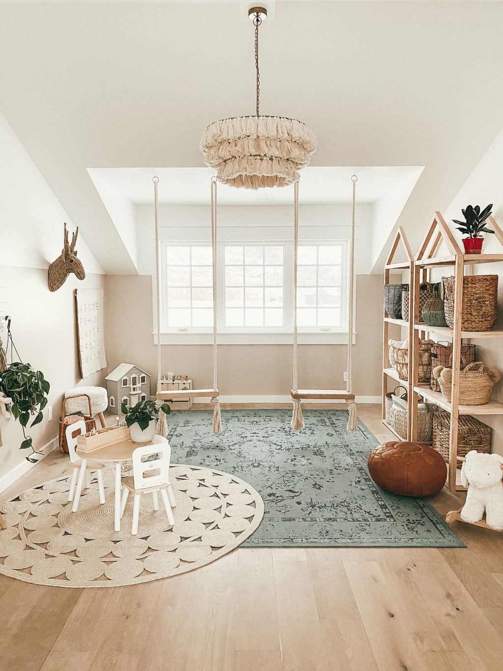 Kids playroom with storage for toys and small table with chairs