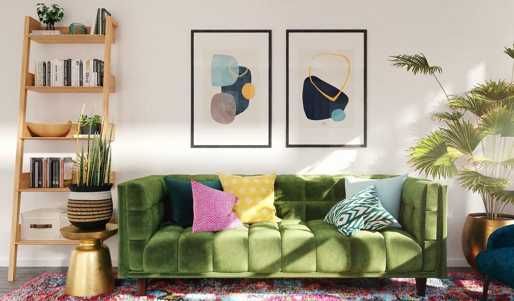 Bohemian living room with velvet green couch, wall art and ladder bookcase 