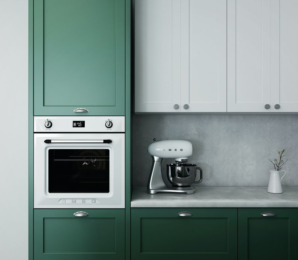 Green and white kitchen cabinets with white appliances 