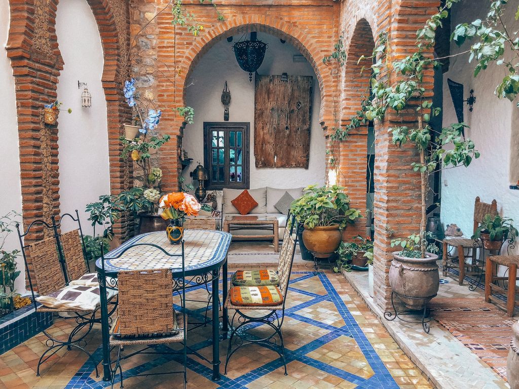Mediterranean Brick inner courtyard with tera cotta potted plants