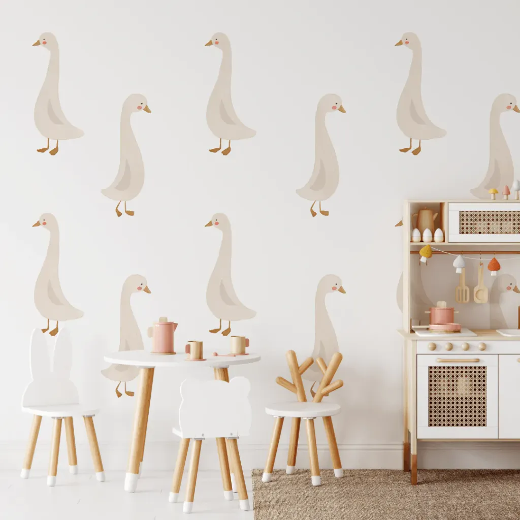 Girl bedroom with goose decals and small table with chairs