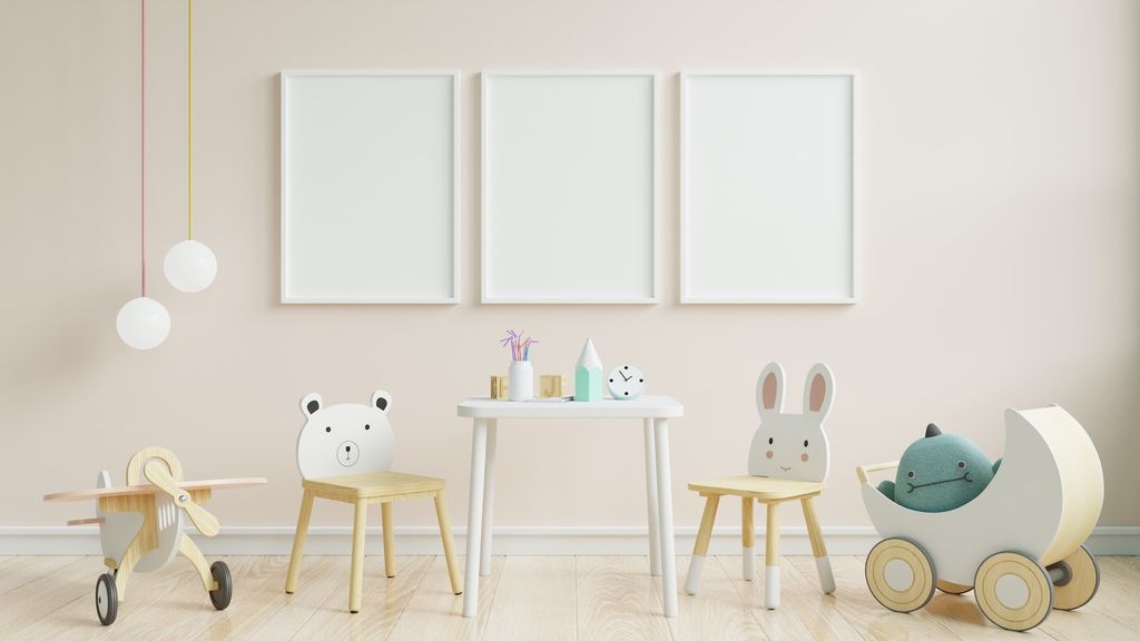 Kids room with 3 dry eraser boards and a table with two chairs