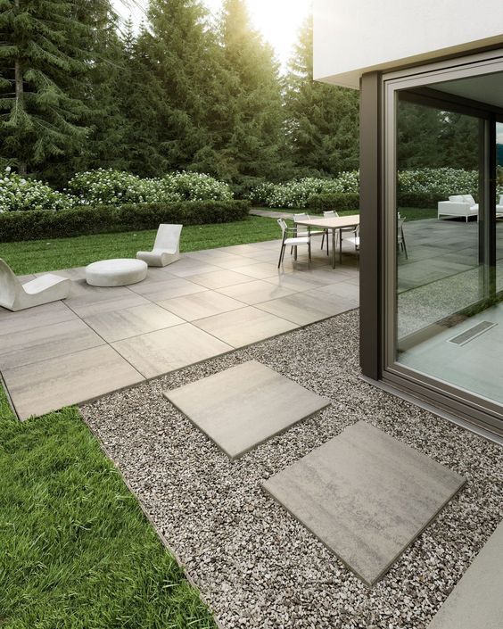 Patio with concrete lounge chairs and table